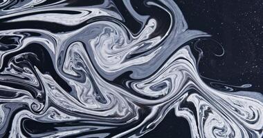 A black and white image of a liquid with swirls photo