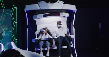 Two people in a virtual reality machine photo