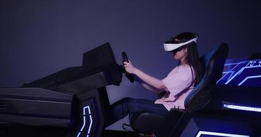 A woman wearing a virtual reality headset is driving a car photo