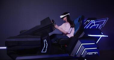 A girl of Asian appearance in virtual reality glasses drives a car in 5D. Virtual simulator for driving training. photo