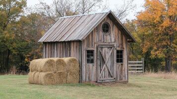 Rustic Wooden Barn in Autumnal Landscape photo