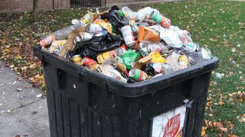Overflowing Trash Bin in a City Environment photo