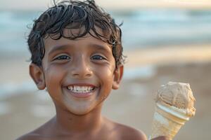 A boy smiles while holding an ice cream cone photo