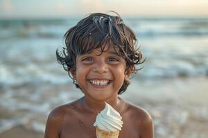A young boy smiles while holding an ice cream cone photo