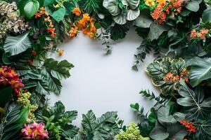 A circular frame made of tropical plants and flowers photo