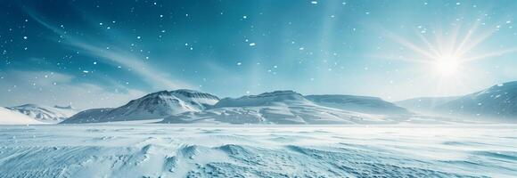 Winter landscape with snow covered mountains and sun shining photo