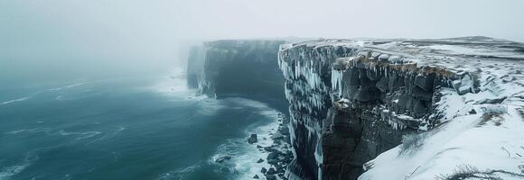 A large cliff with ice on it in the ocean photo