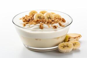 A bowl of yogurt with bananas and granola photo