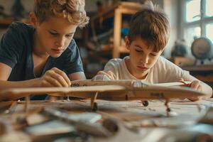 Two boys are working on a model airplane photo