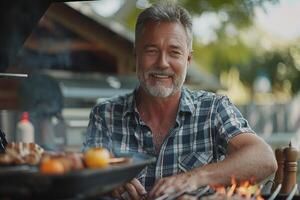 A man is smiling while cooking on a grill photo