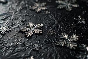 Snowflakes on a black surface photo