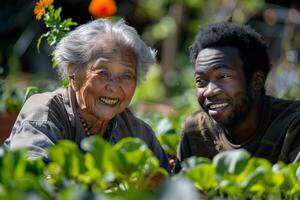 A man and woman smile while standing in a garden photo
