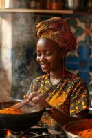 A woman in an african print dress is cooking food photo