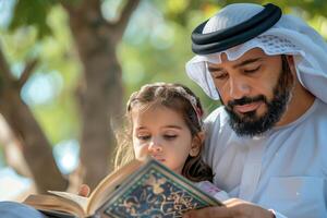 Arabic father and daughter reading a book photo