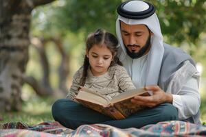 Arabic father and daughter reading book in park photo