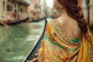 A woman in a sari standing on a boat photo