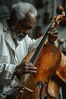 An old man playing a cello photo
