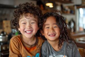 Two young children smiling at the camera photo