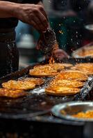 A man is cooking food on a grill photo