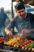 A man cooking on a grill photo