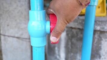 Close Up of Blue Water Pipe with Red Valve Essential Plumbing Equipment and Infrastructure for Effective Water Control and Connection in Piping Systems video