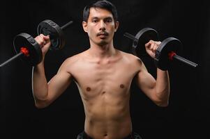Man Lifting Dumbbells in a Studio for Health and Strength Training photo