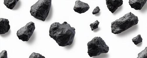 Dark Gray Rocks Scattered On White Background photo