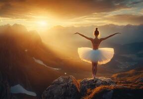 Ballerina On Mountain Peak At Sunset photo