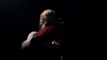 Silhouette with backlitwoman fighter practicing quick strikes shadow boxing fight video
