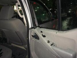 Hail Damage to Car, Broken Back Window from Inside photo