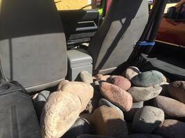 River Rocks in the Back of an SUV, Transporting them for Landscaping photo