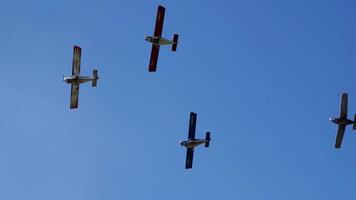 Experience the Thrilling Aerial Formation of Vintage Airplanes Flying in a Clear Blue Sky. Media video