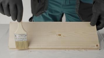 A craftsperson transforms wood with a beautiful stain, showcasing techniques. Creative video