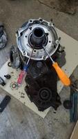Using Two Screwdrivers to Remove a Snap Ring on a Transfer Case photo