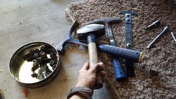 Selecting a Hammer while Working on Cars in my Garage photo