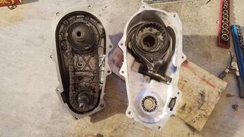 Two Halves of a Transfer Case from 1990s SUV Opened Up to Work On and Repair photo