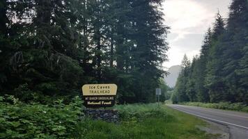 Ice Caves Trailhead Sign on the Side of Mountain Loop Highway, Washington photo