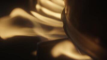 Experience the Dynamic Motion of Flames with Captivating Warm Light Effects Enhancing the Scene. Media video