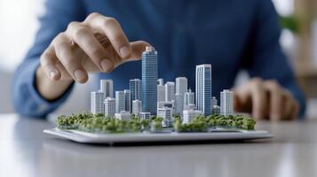 Person Arranging Model City on Tablet photo