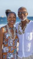 Smiling Couple Posing by the Ocean on Sunny Day photo