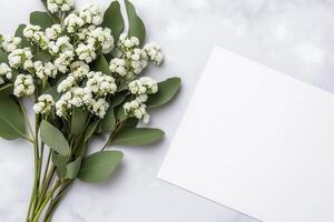 White Flowers and Blank Card on Gray Background photo