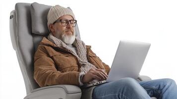 Senior Man Working on Laptop in Comfortable Chair photo