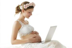 Pregnant Woman with Floral Crown Using Laptop photo