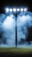 Bright Stadium Lights in Blue Night Fog photo