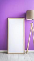 Blank White Frame Mockup Against Purple Wall photo