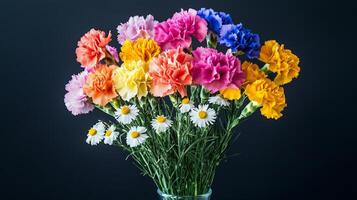 A vase filled with colorful carnations and daisies photo