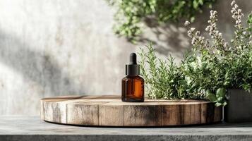 A bottle of essential oil sits on a wooden board photo