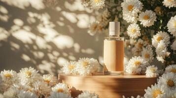 A bottle of perfume sits on top of a wooden table surrounded by white flowers photo