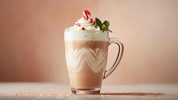 A hot chocolate with whipped cream and peppermint photo