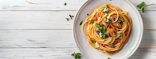 Spaghetti with mushrooms and tomato sauce on white wooden table top view photo